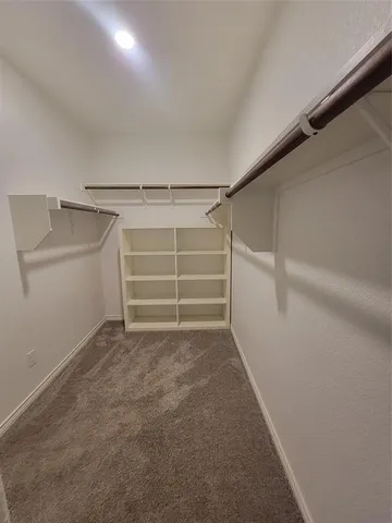 a view of an empty walk in closet