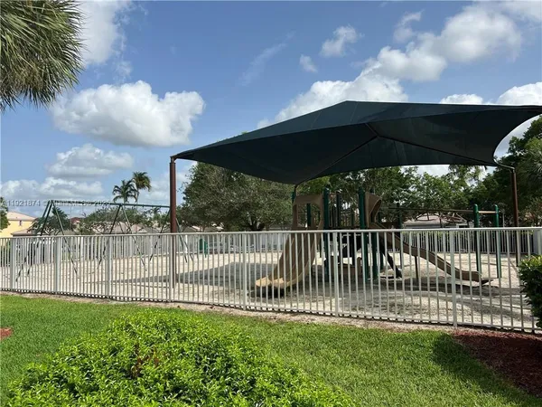 a view of a wrought iron fences in front of house
