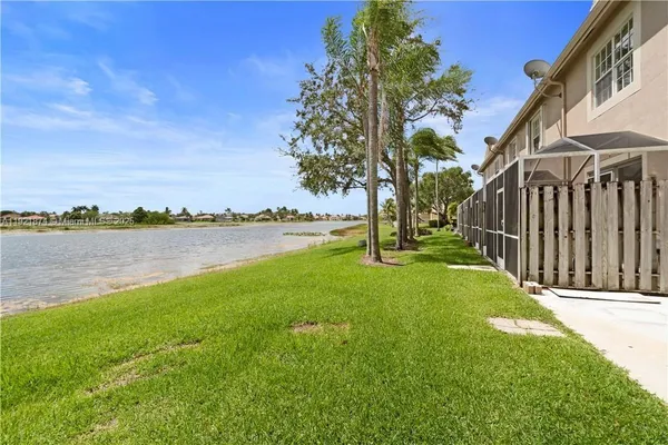 a view of a lake with a yard