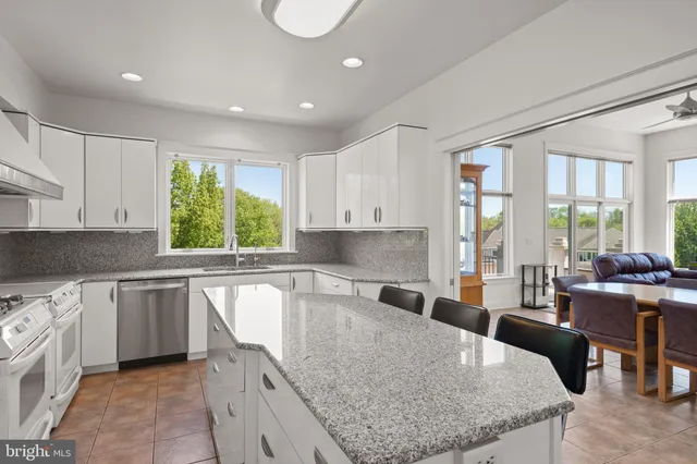 a white toilet sitting next to a bathroom sink