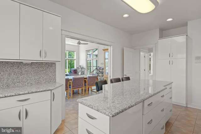 a bathroom with a sink a toilet and vanity