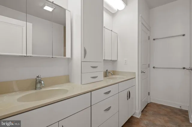 a front view of a house with a yard table and chairs