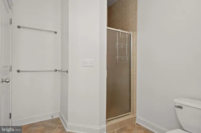 an aerial view of a house with outdoor space and street view