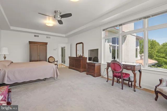 a front view of a house with a garden and a yard