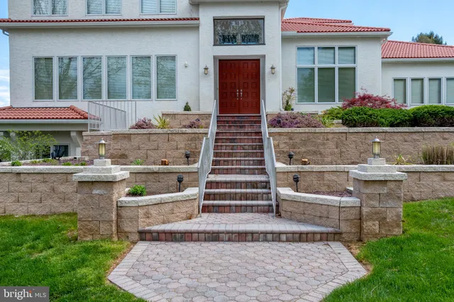 a view of staircase with white walls and windows
