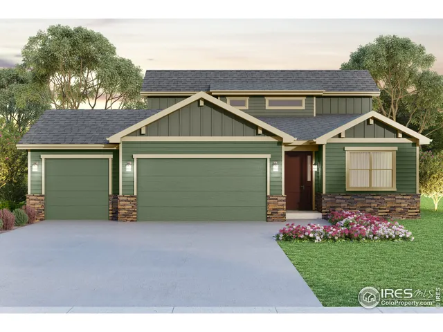 a front view of a house with a garden and garage