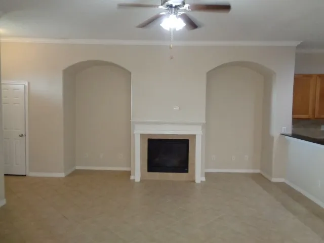 a view of empty room with fireplace