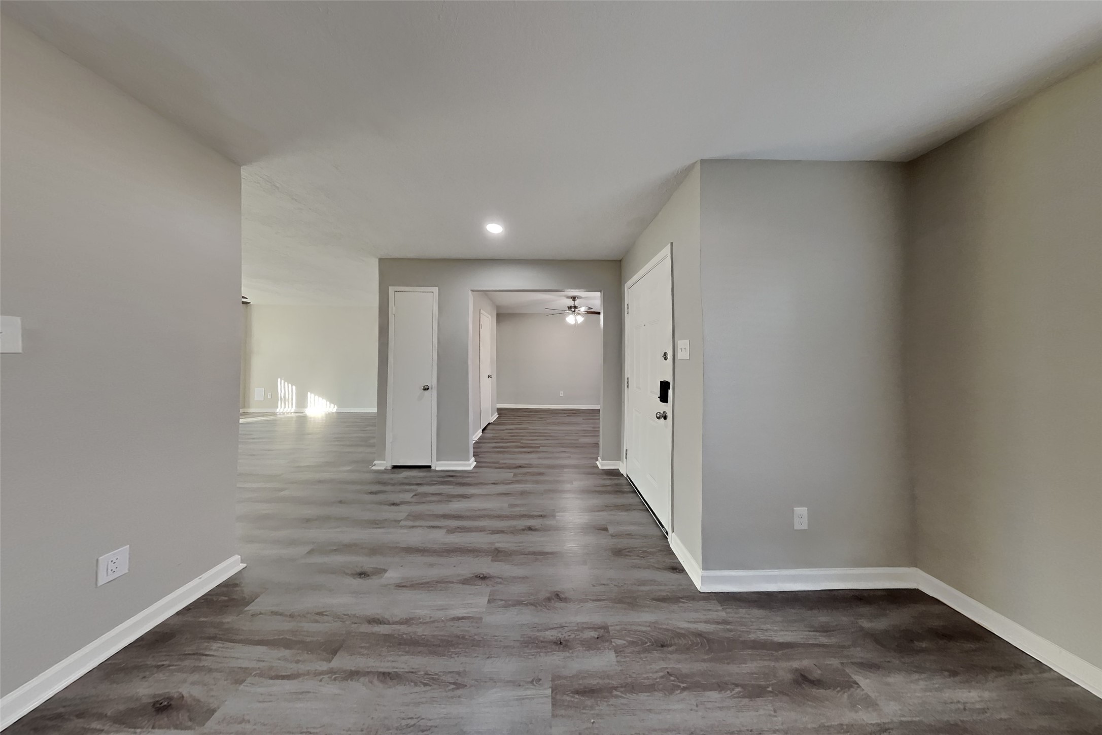 2217 Clemson Drive Katy, TX 77493 - Photo 3 of 18 a view of a hallway with wooden floor