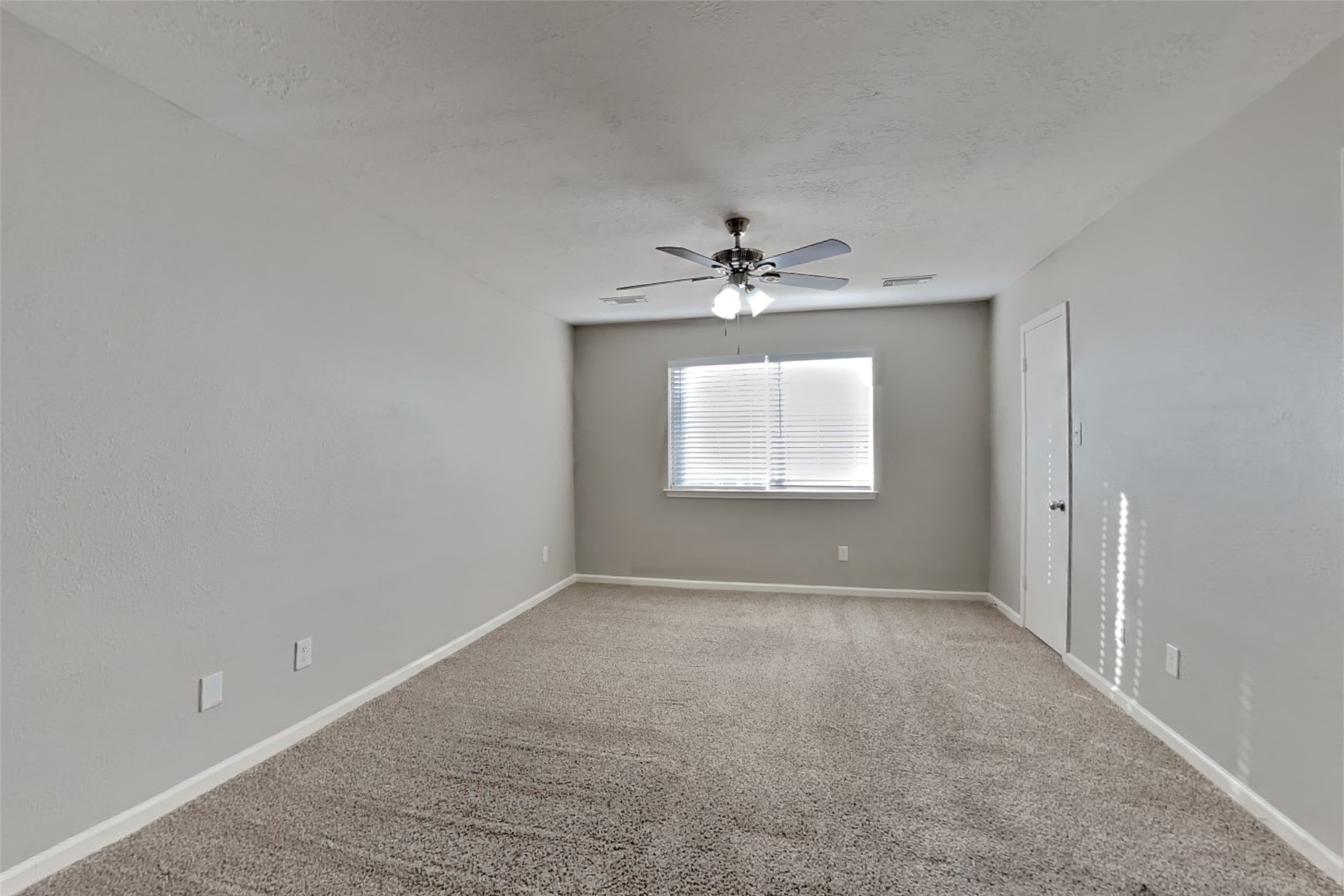 2217 Clemson Drive Katy, TX 77493 - Photo 9 of 18 a view of an empty room with a window