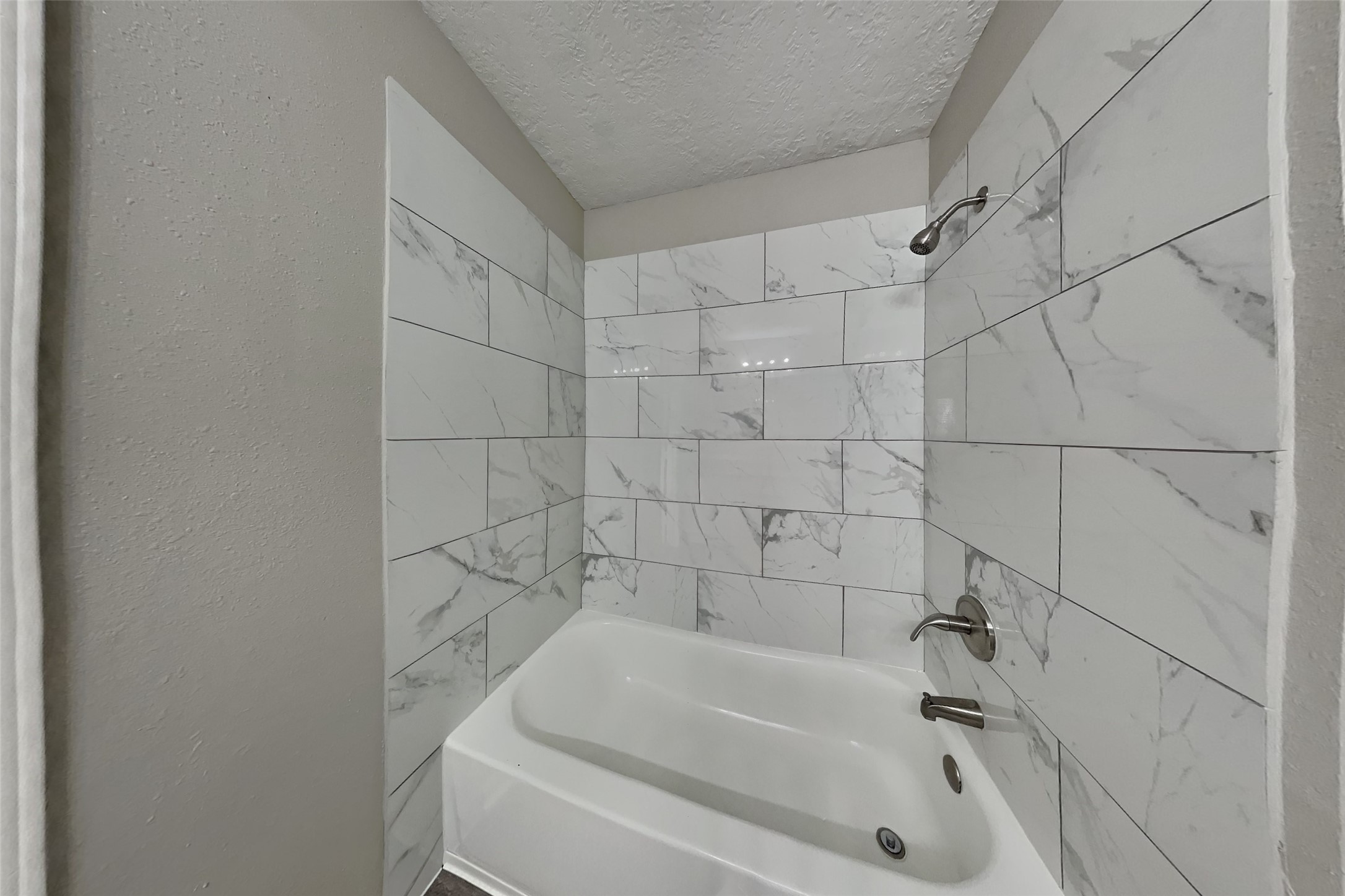 2217 Clemson Drive Katy, TX 77493 - Photo 10 of 18 a bathroom with a bathtub and shower