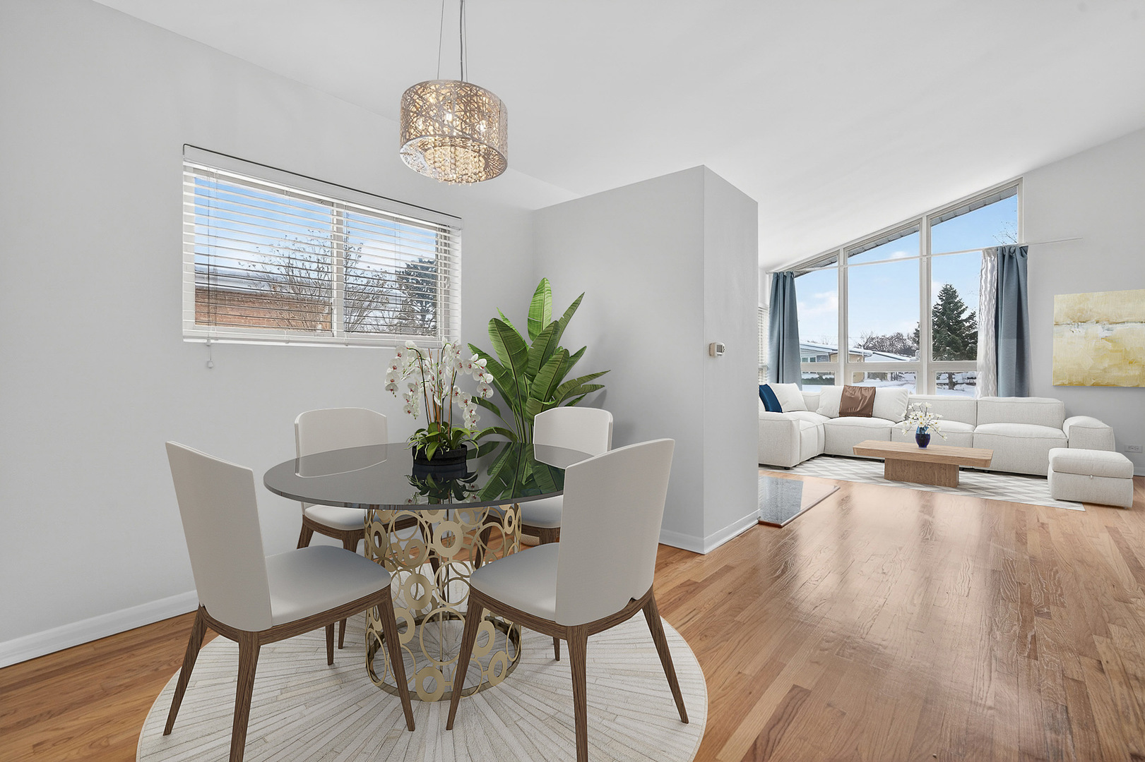 8516 West Normal Avenue Niles, IL 60714 - Photo 12 of 35 a view of a dining room with furniture a chandelier and wooden floor