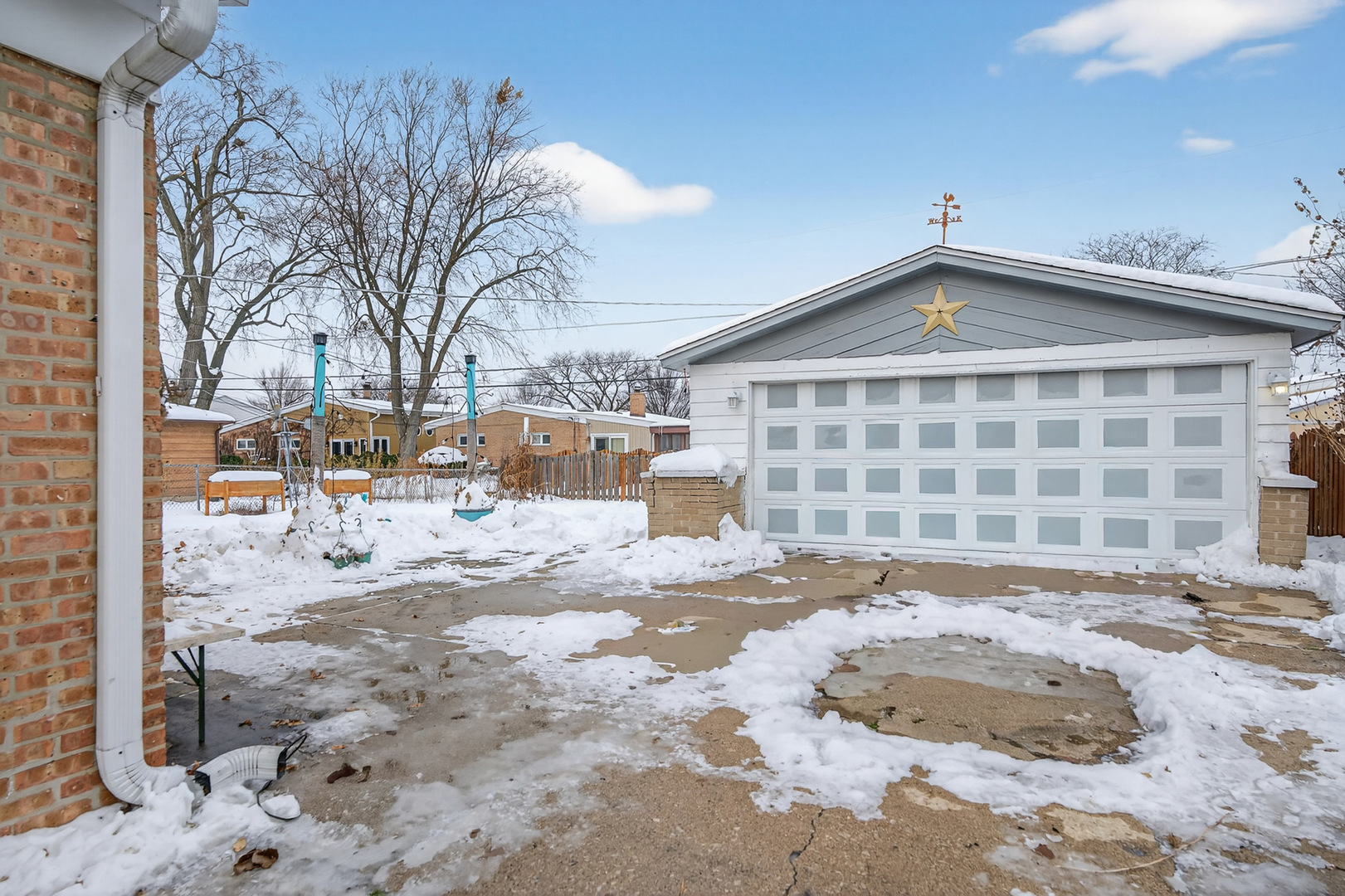 8516 West Normal Avenue Niles, IL 60714 - Photo 30 of 35 a view of a house with a yard covered in snow