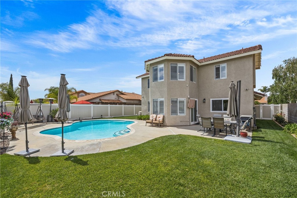 20257 Edmund Road Riverside, CA 92508 - Photo 40 of 53 a backyard of a house with table and chairs