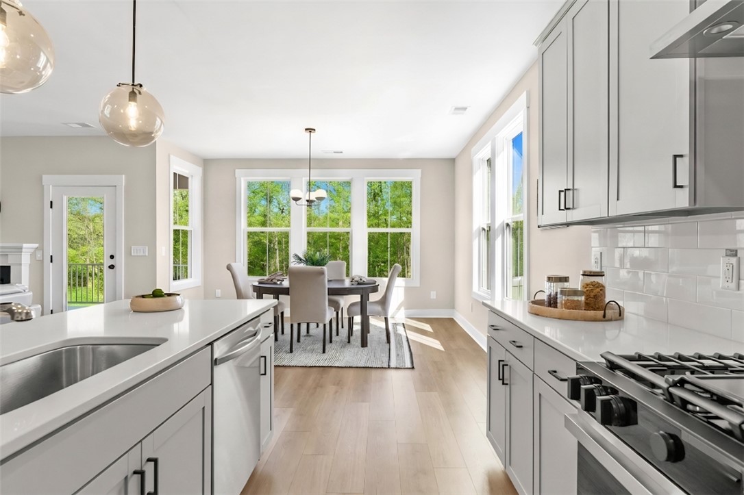 334 Summerall Drive Anderson, SC 29621 - Photo 27 of 28 This bright kitchen with modern details and abundant natural light flows seamlessly into the dining area.