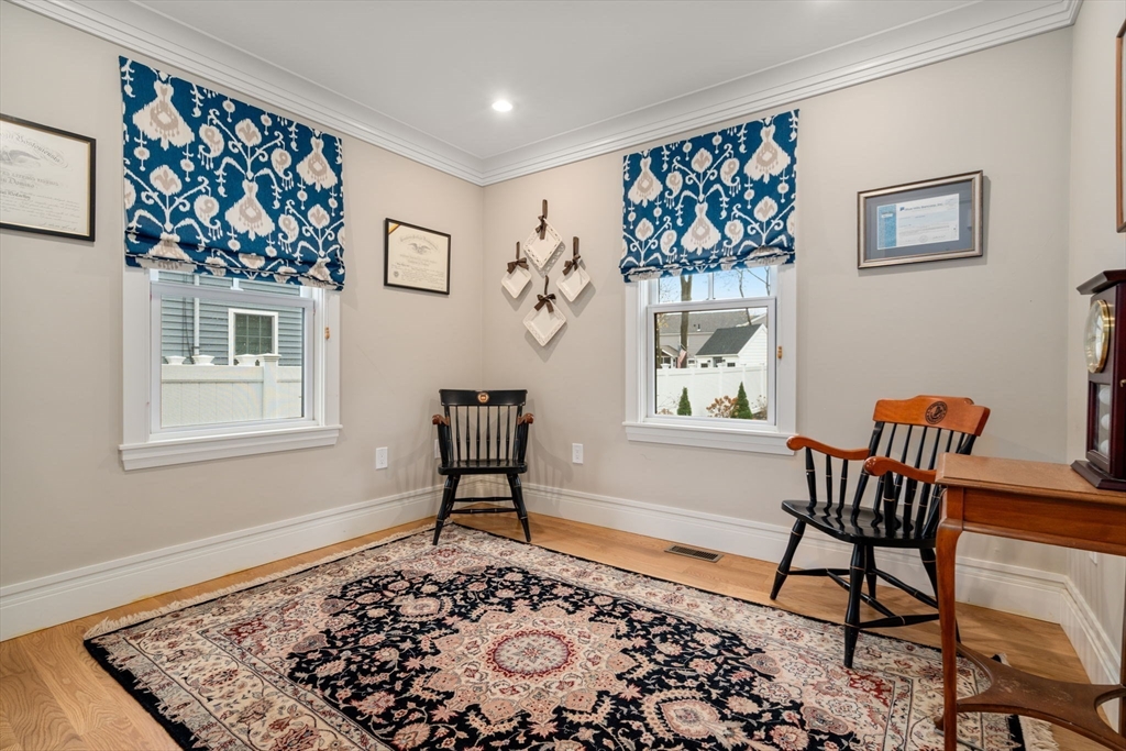 106 Jefferson Street Dedham, MA 02026 - Photo 19 of 42 a living room with a couch and a window