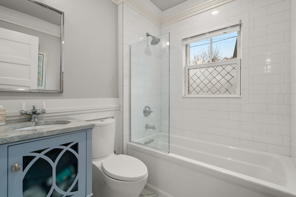 106 Jefferson Street Dedham, MA 02026 - Photo 20 of 42 a bathroom with a granite countertop toilet sink and shower