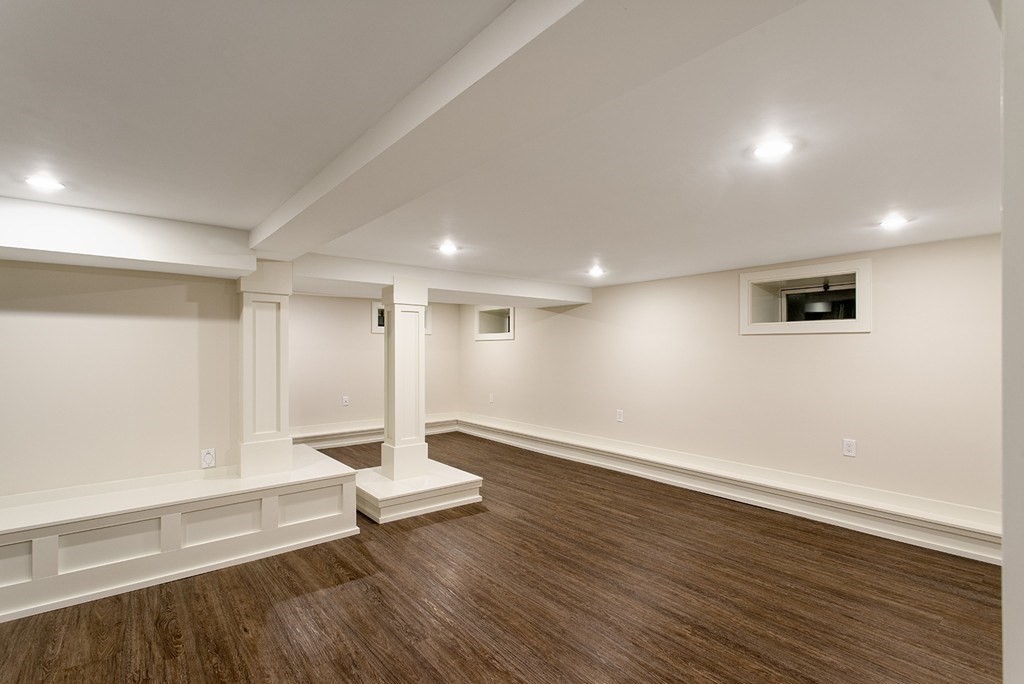 106 Jefferson Street Dedham, MA 02026 - Photo 32 of 42 a view of an empty room with wooden floor and a window