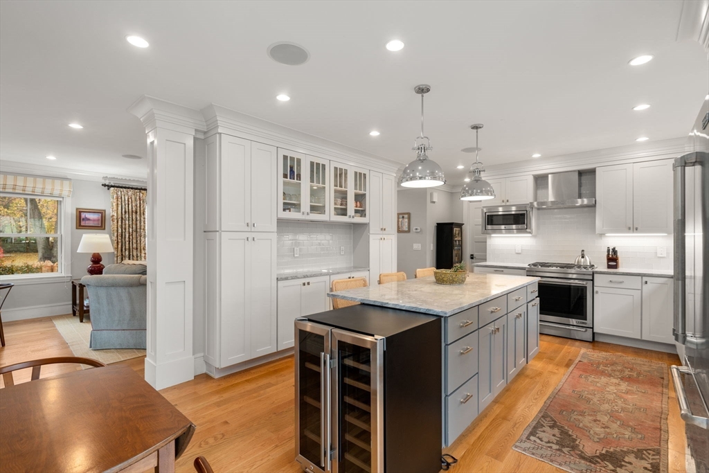 106 Jefferson Street Dedham, MA 02026 - Photo 10 of 42 a kitchen with stainless steel appliances granite countertop a sink stove and refrigerator