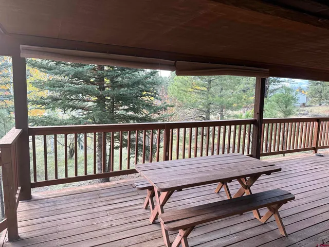 a view of a wooden deck with a table