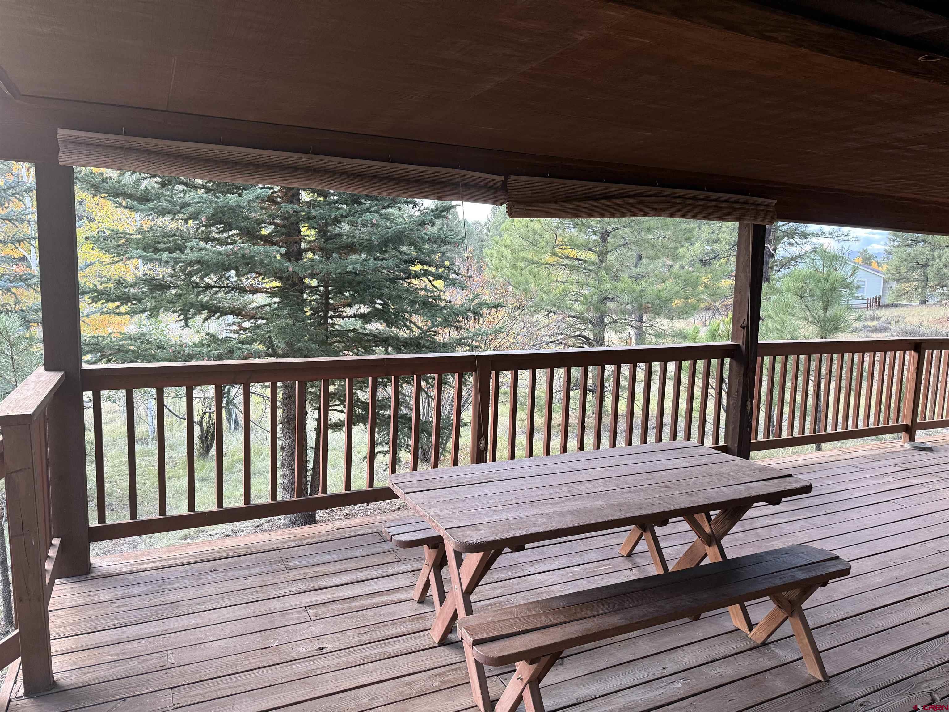 285 Beaver Circle Pagosa Springs, CO 81147 - Photo 11 of 42 a view of a wooden deck with a table
