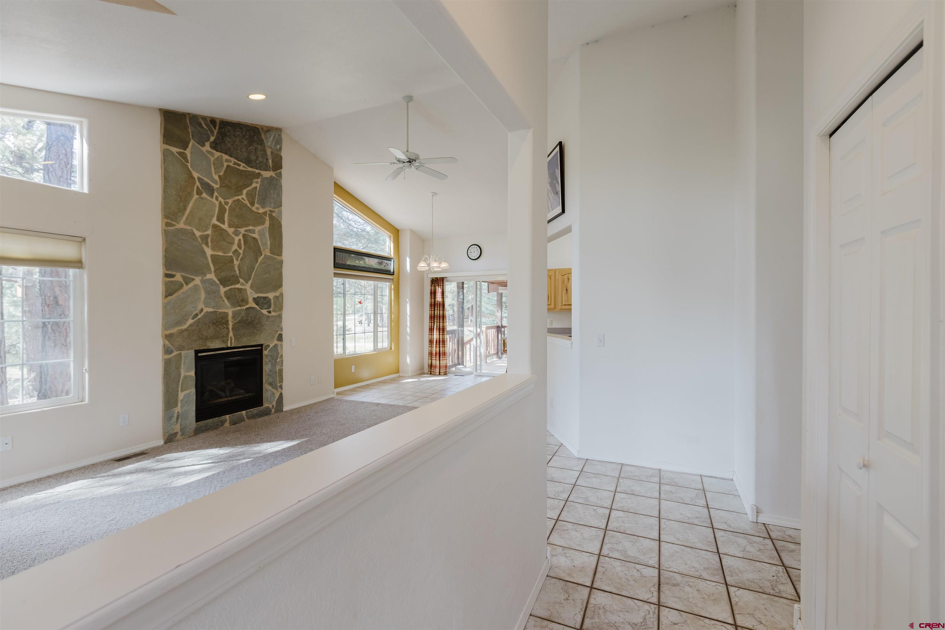 285 Beaver Circle Pagosa Springs, CO 81147 - Photo 14 of 42 a view of a livingroom with wooden floor and a fireplace