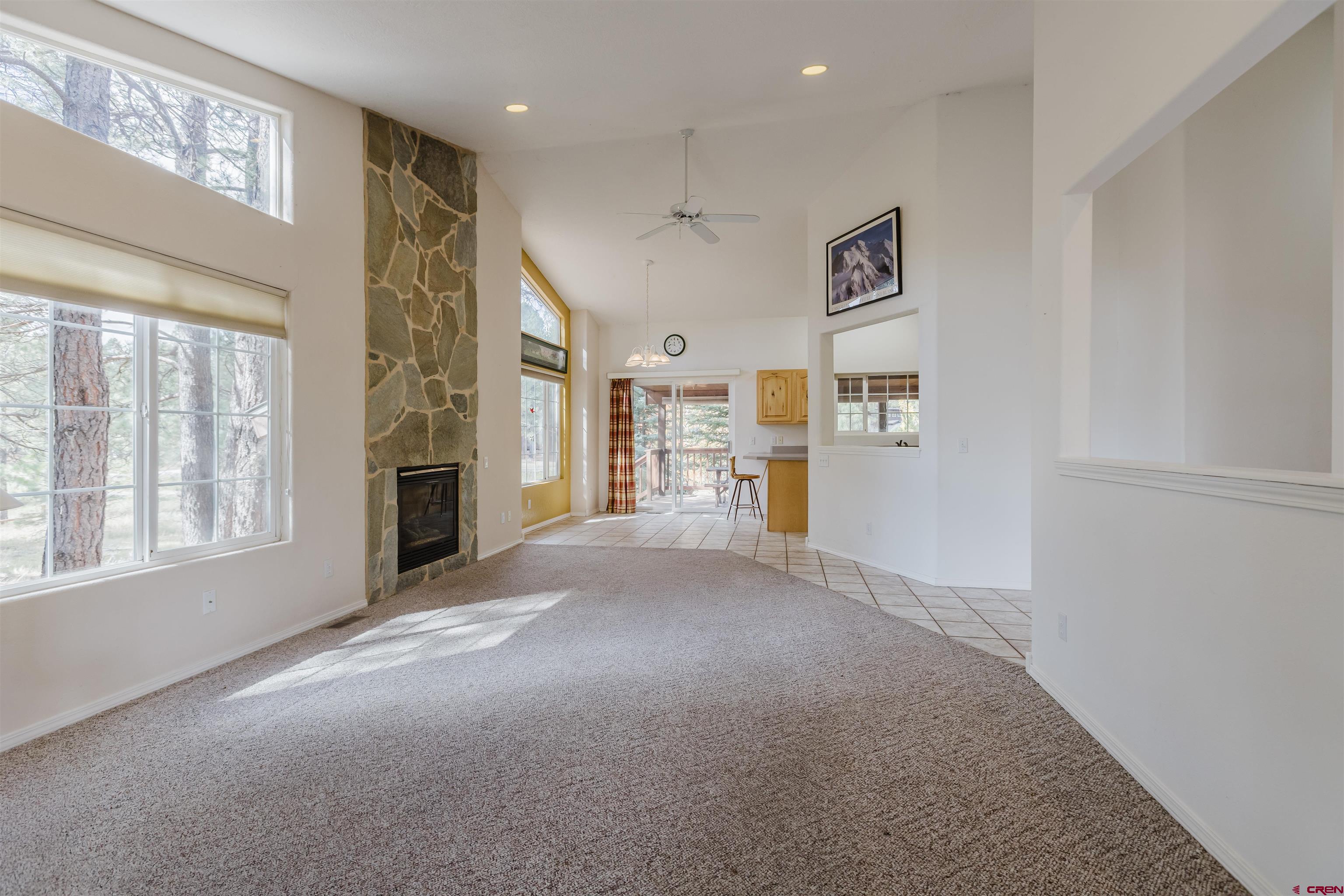 285 Beaver Circle Pagosa Springs, CO 81147 - Photo 17 of 42 a view of a hallway with furniture and windows