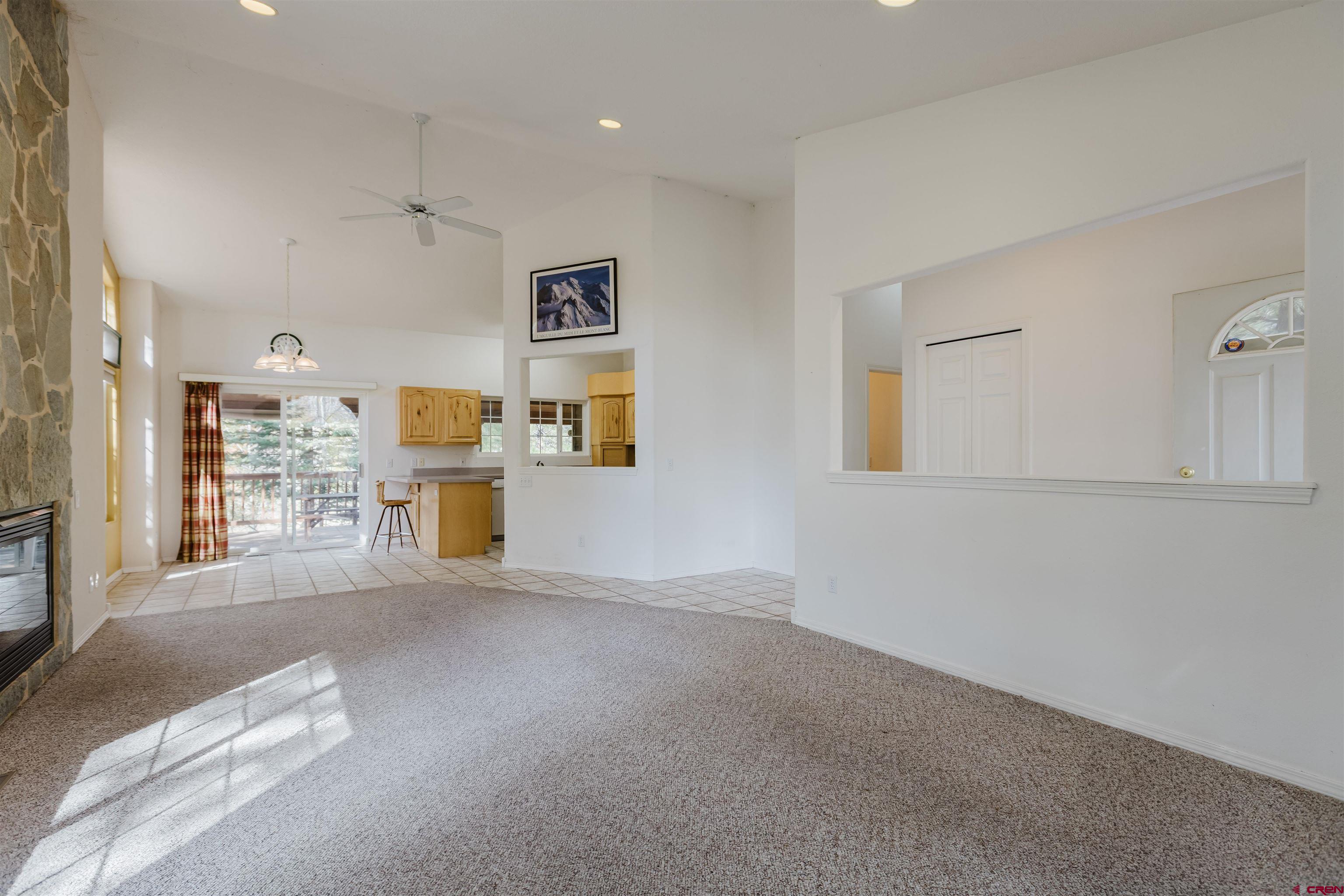 285 Beaver Circle Pagosa Springs, CO 81147 - Photo 18 of 42 a view of empty room with cabinet and kitchen view