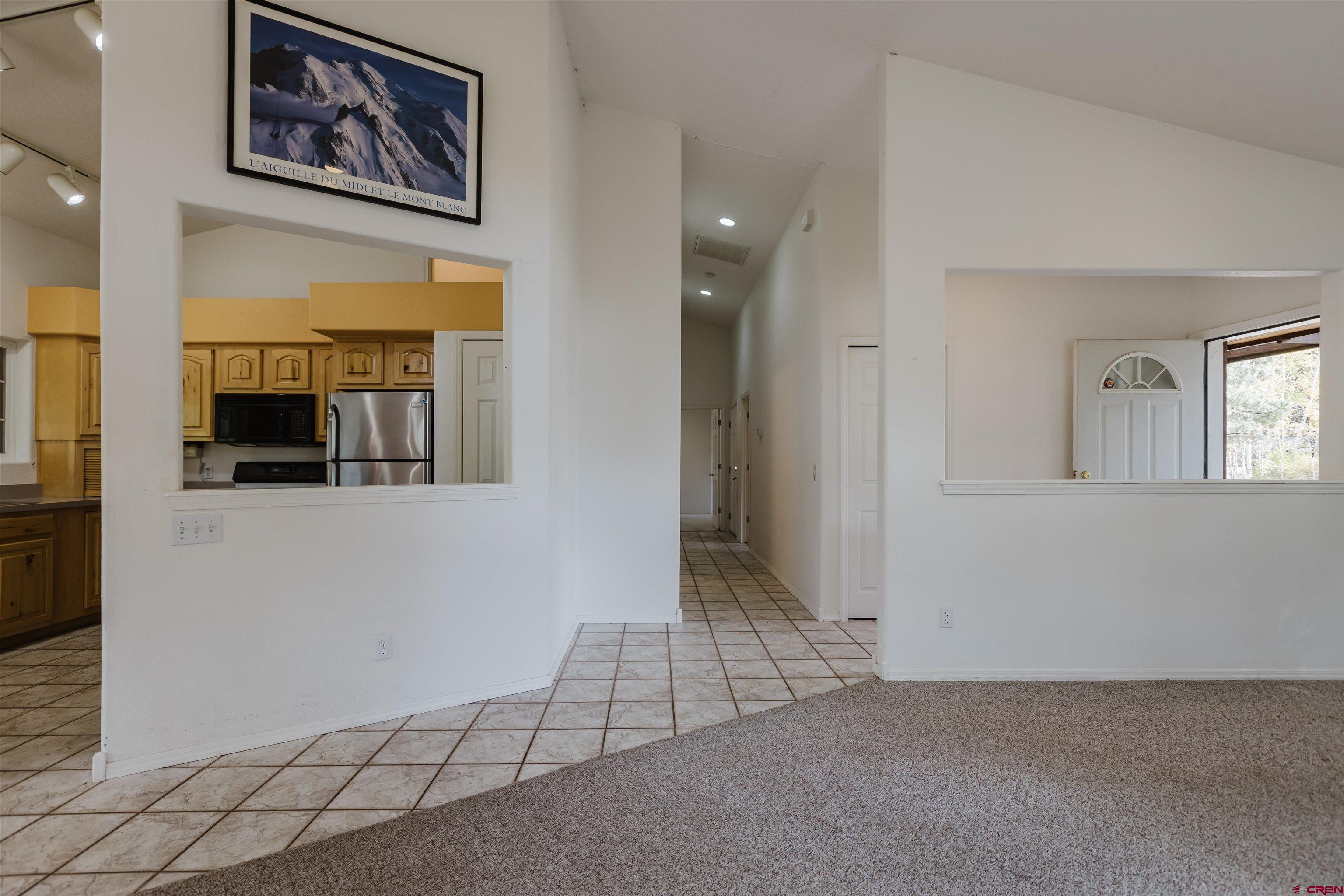 285 Beaver Circle Pagosa Springs, CO 81147 - Photo 19 of 42 en empty room with wooden floor
