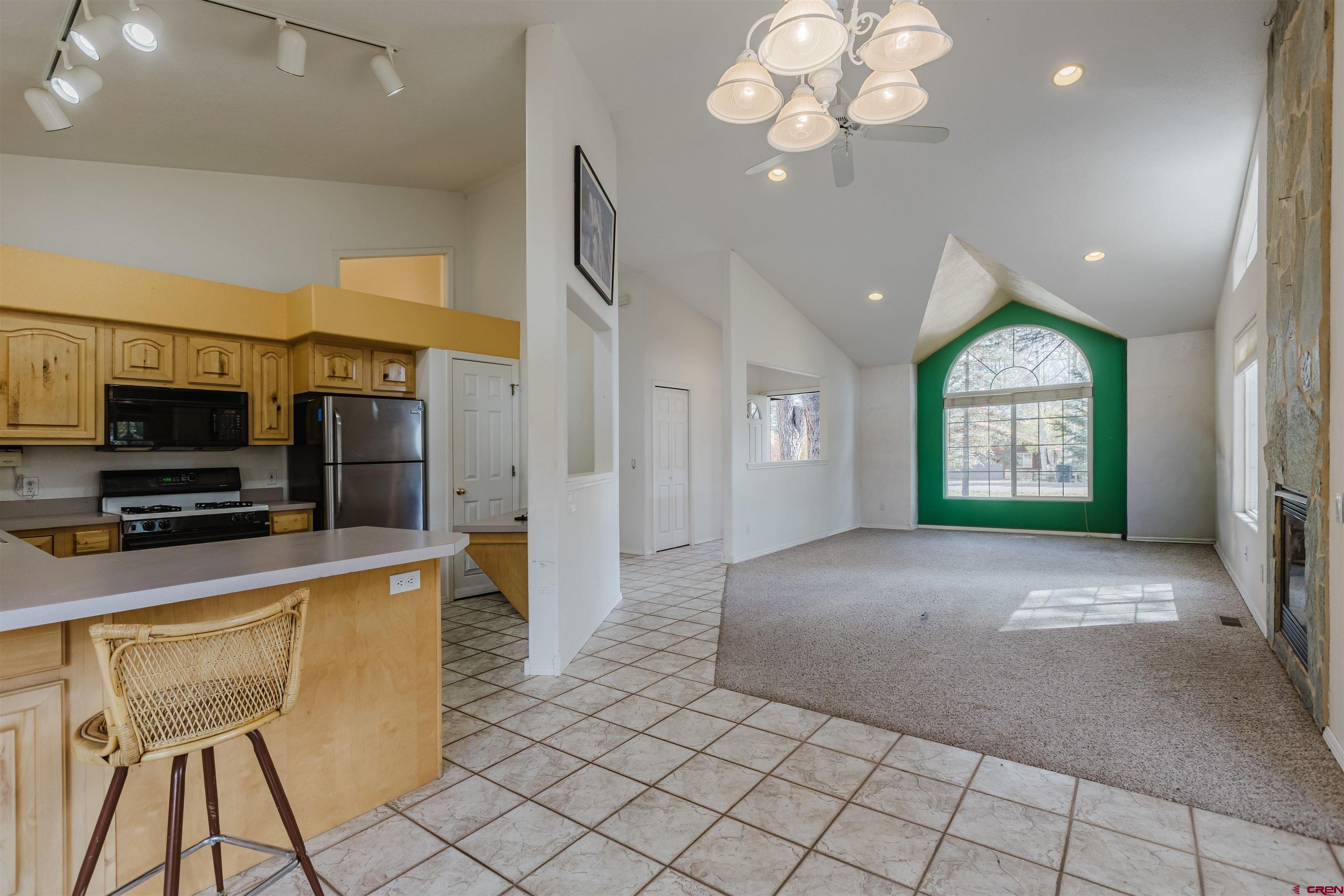 285 Beaver Circle Pagosa Springs, CO 81147 - Photo 20 of 42 a view of a livingroom with kitchen and furniture