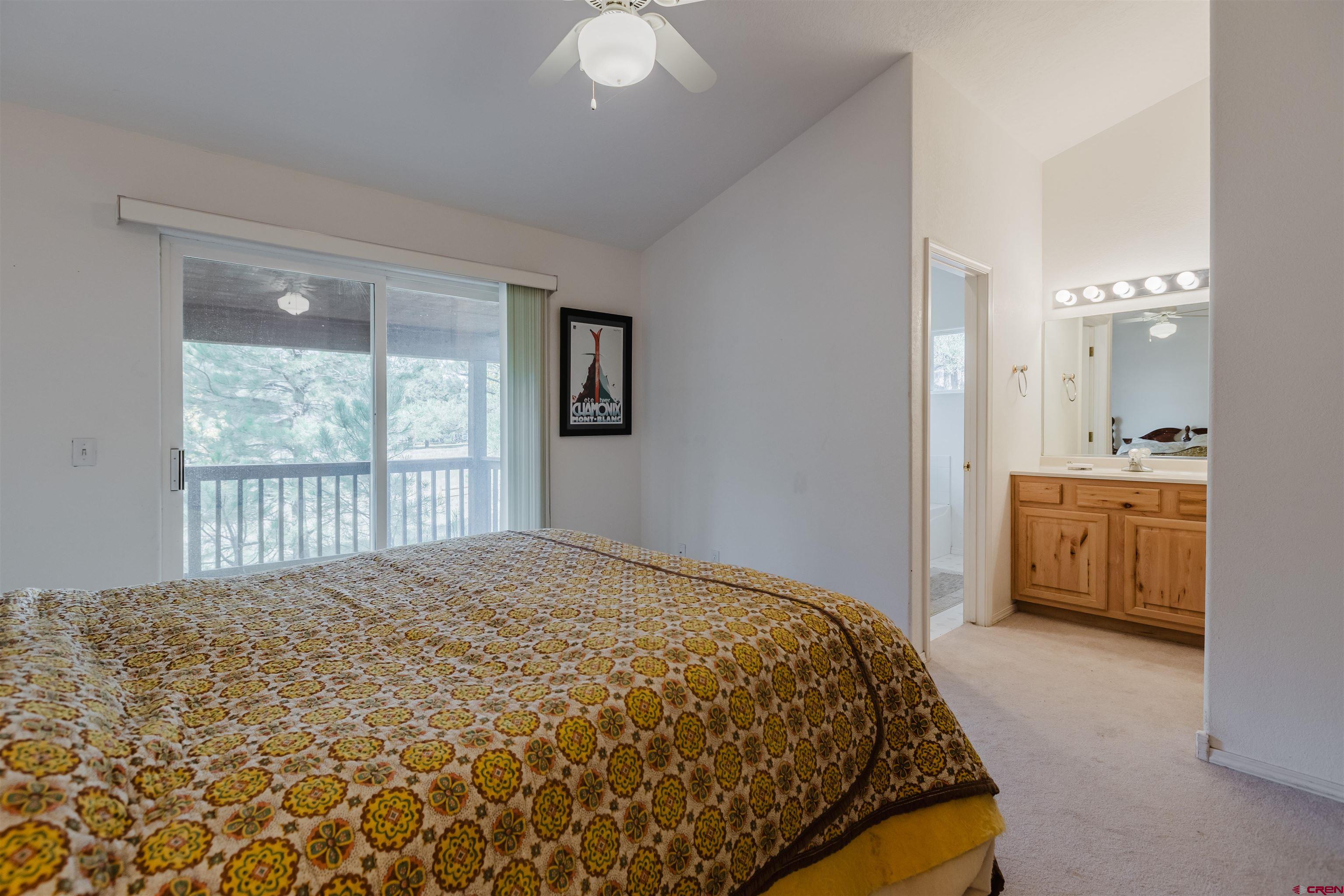 285 Beaver Circle Pagosa Springs, CO 81147 - Photo 26 of 42 a bedroom with a bed and a window