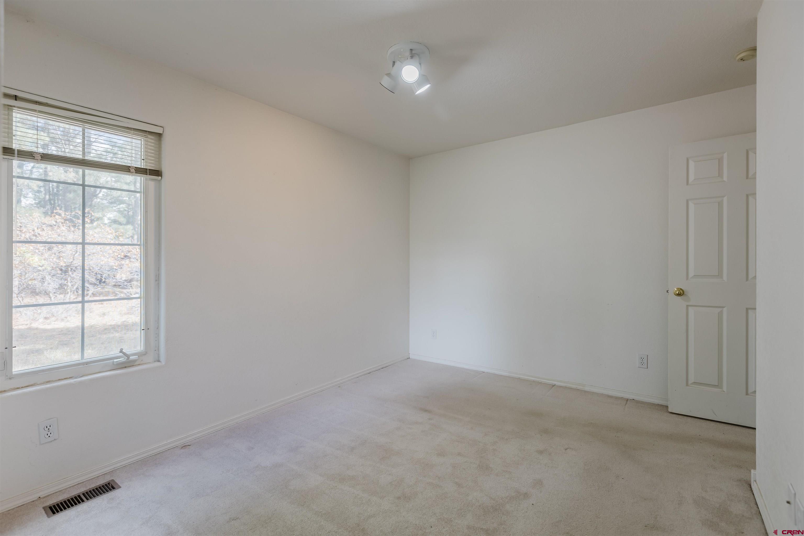 285 Beaver Circle Pagosa Springs, CO 81147 - Photo 31 of 42 an empty room with a window