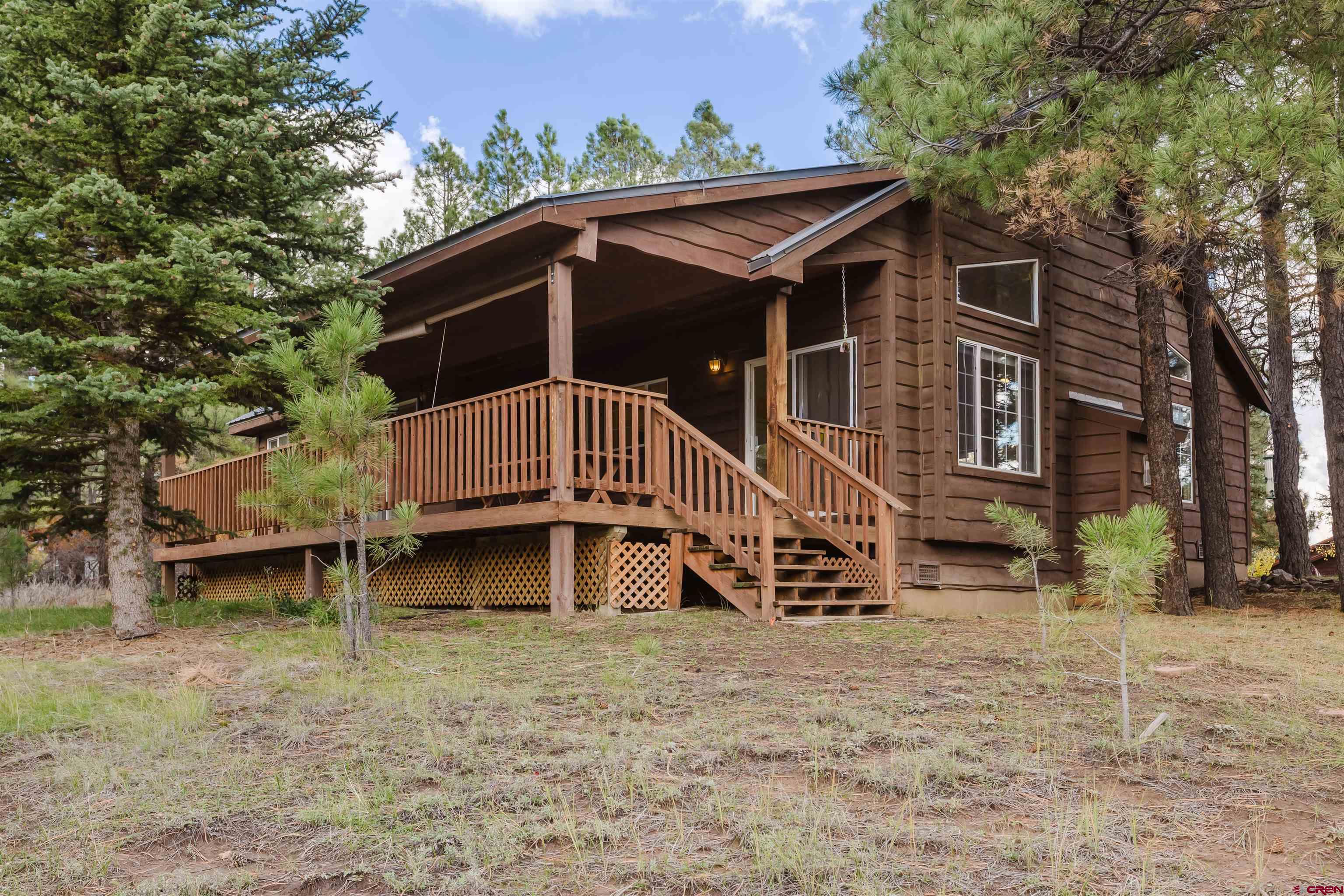 285 Beaver Circle Pagosa Springs, CO 81147 - Photo 6 of 42 a view of a house with a yard