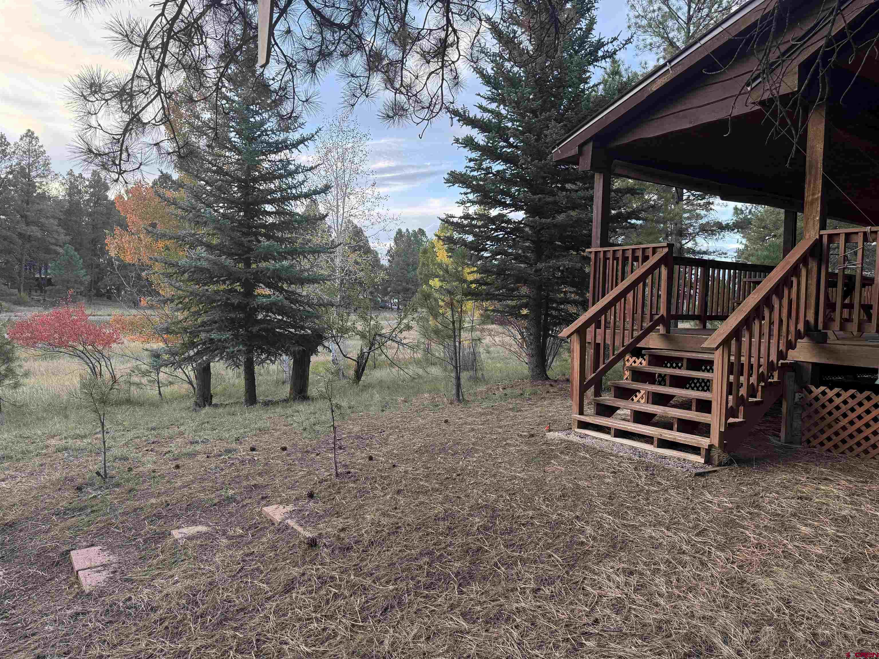 285 Beaver Circle Pagosa Springs, CO 81147 - Photo 7 of 42 a view of a house with a yard