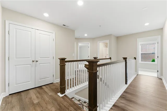 a view of a hallway with a hardwood floor