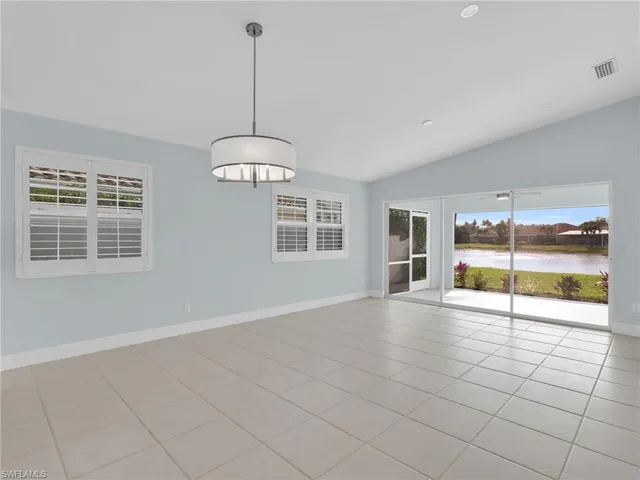 a view of a kitchen with a sink and a window