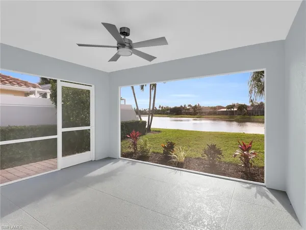 a view of a lake with houses in the back