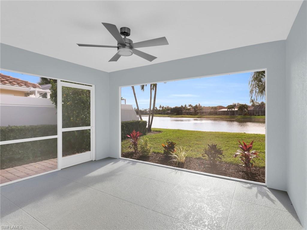 4231 Redonda Lane Naples, FL 34119 - Photo 22 of 42 a view of a room with wooden floor and windows
