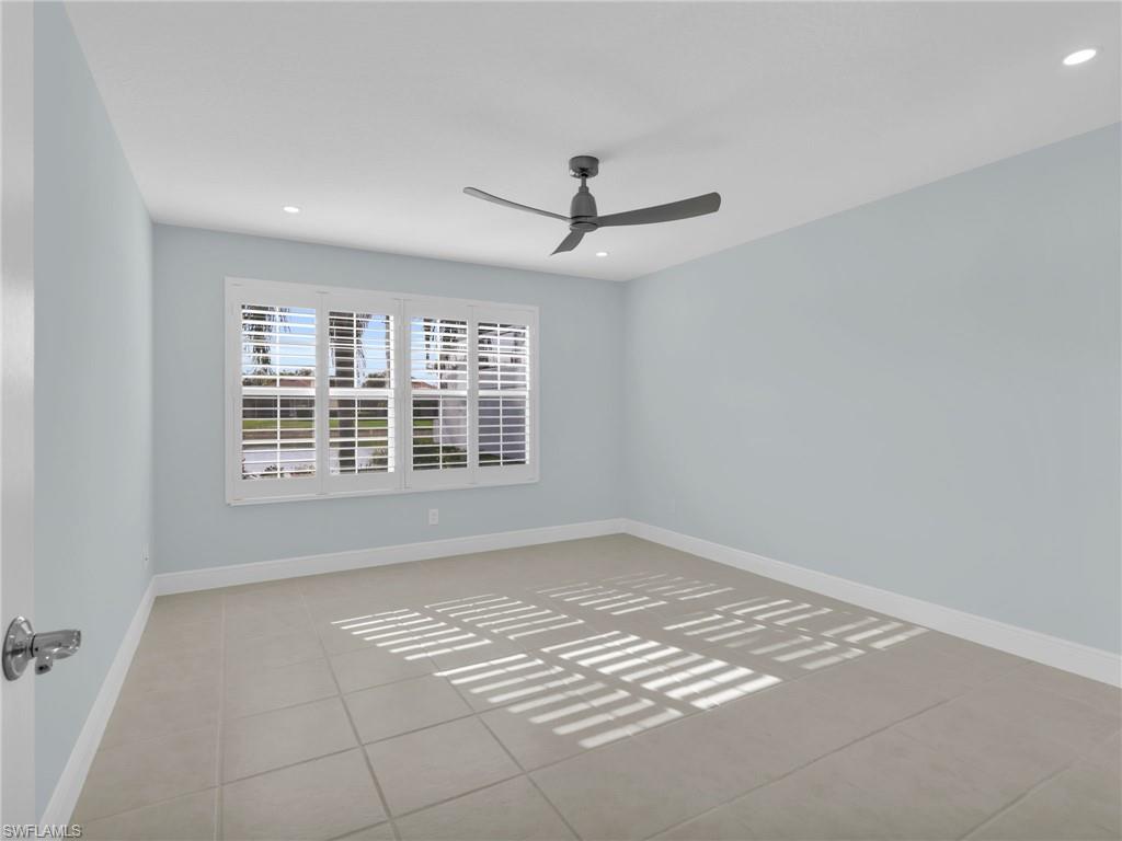 4231 Redonda Lane Naples, FL 34119 - Photo 26 of 42 a view of an empty room with a window