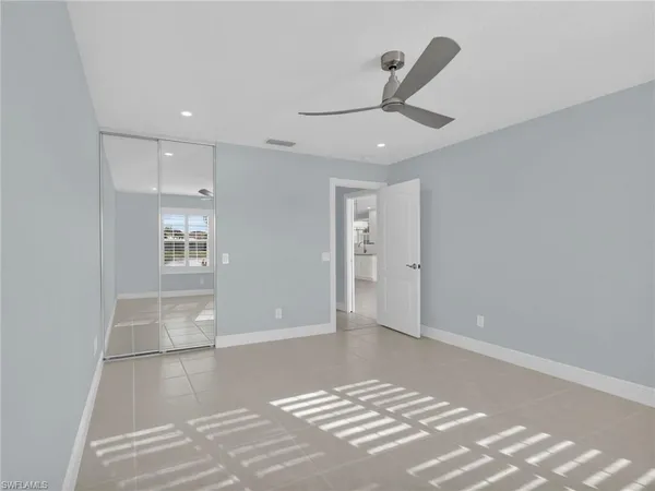 a bathroom with double vanity sink a mirror a shower and vanity