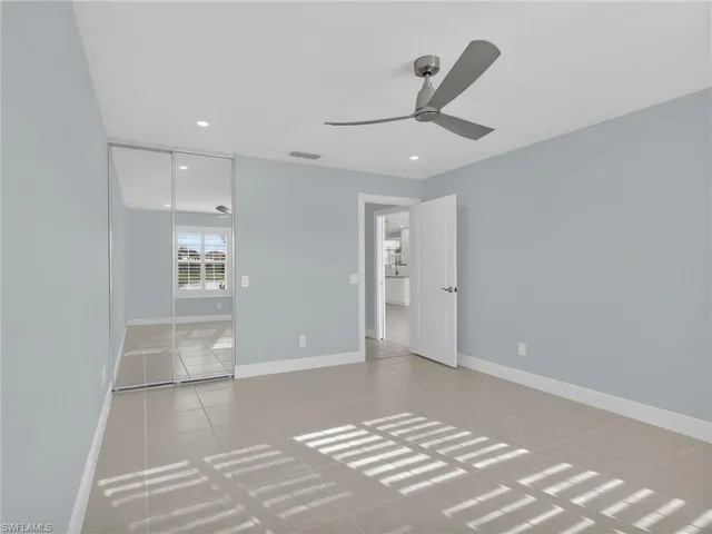 a bathroom with double vanity sink a mirror a shower and vanity