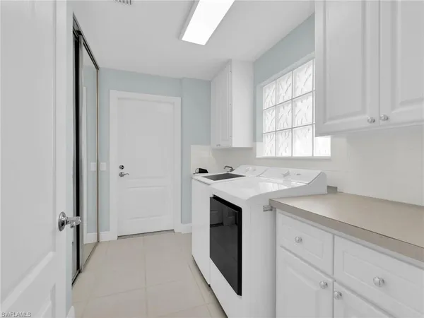 a view of a livingroom with a refrigerator