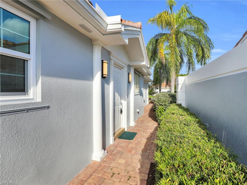 4231 Redonda Lane Naples, FL 34119 - Photo 5 of 42 a view of a house with a potted plant