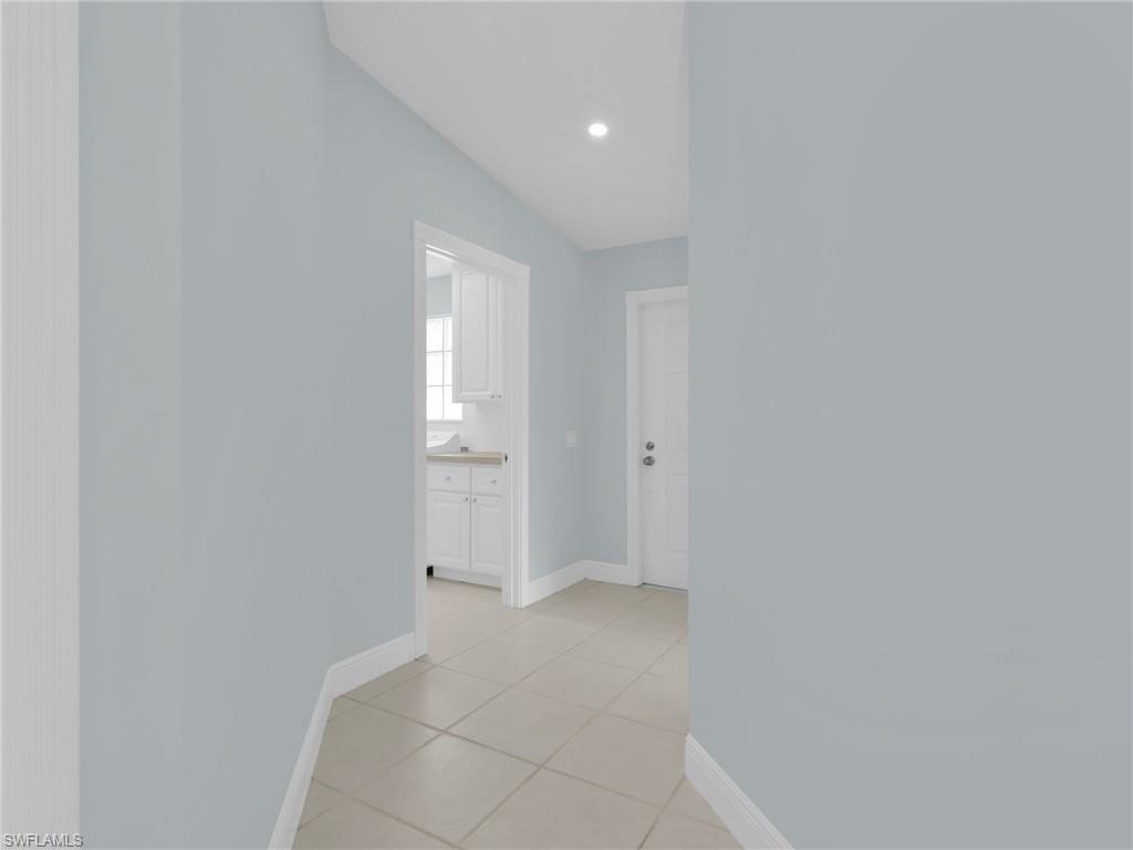 4231 Redonda Lane Naples, FL 34119 - Photo 7 of 42 a view of an empty room