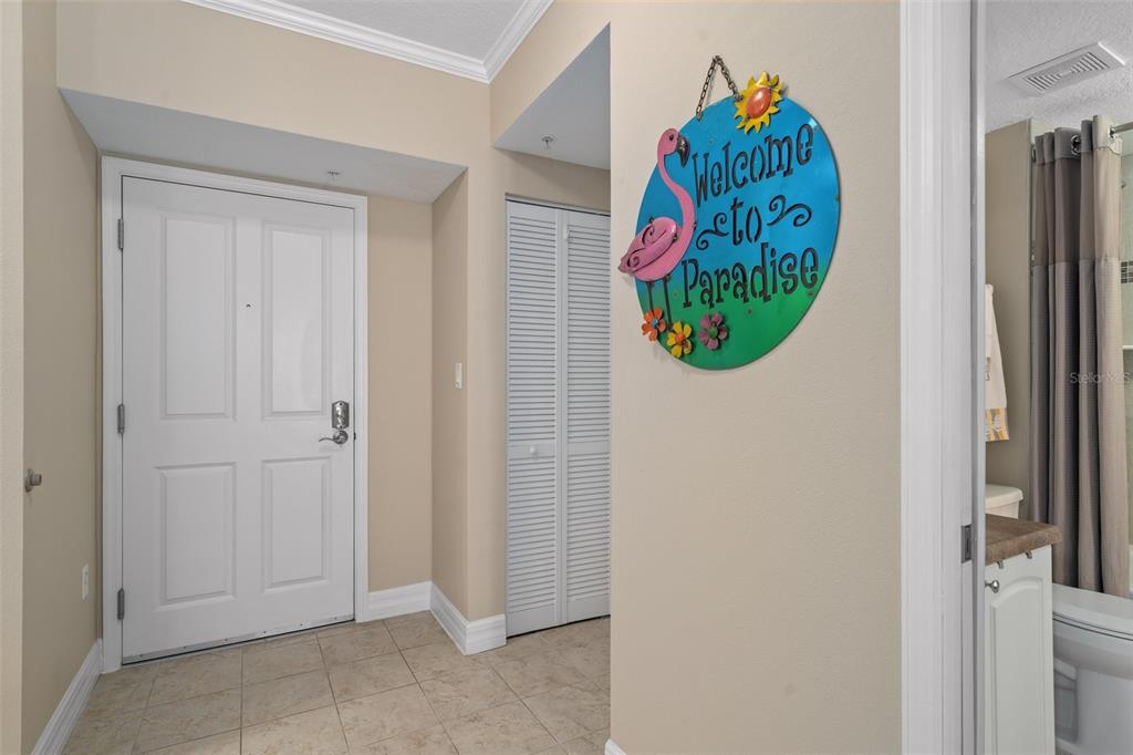 4516 Seagull Drive, Unit 810 New Port Richey, FL 34652 - Photo 24 of 54 a view of kitchen cabinetry and a refrigerator