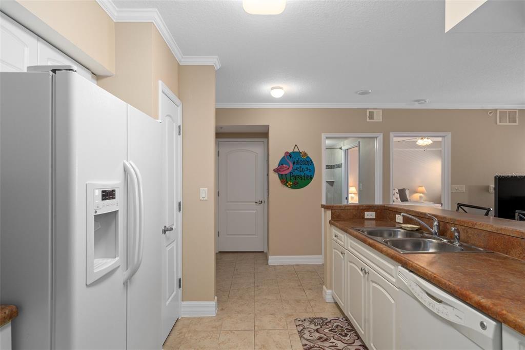 4516 Seagull Drive, Unit 810 New Port Richey, FL 34652 - Photo 28 of 54 a kitchen with stainless steel appliances granite countertop a refrigerator and a sink