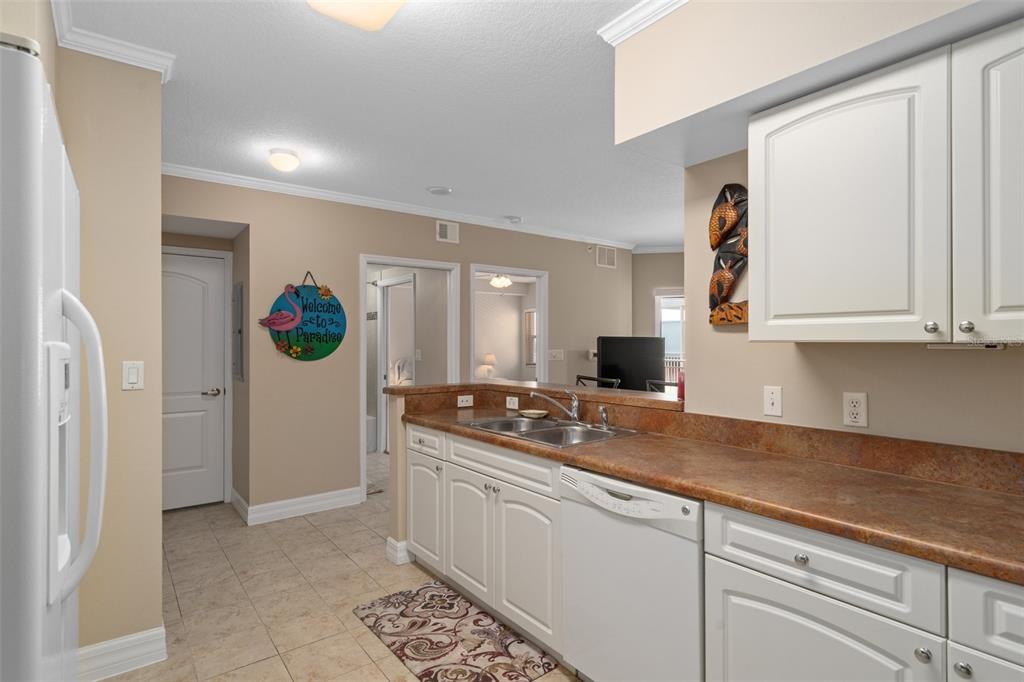 4516 Seagull Drive, Unit 810 New Port Richey, FL 34652 - Photo 32 of 54 a kitchen with a sink and cabinets
