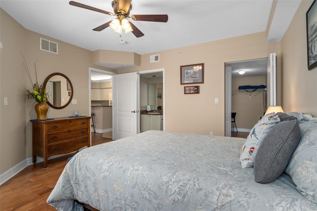 4516 Seagull Drive, Unit 810 New Port Richey, FL 34652 - Photo 38 of 54 a bedroom with a bed and cabinets