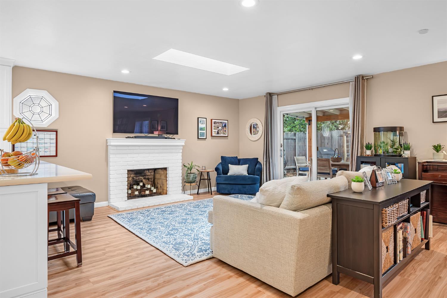 5220 Shelato Way Carmichael, CA 95608 - Photo 11 of 40 a living room with furniture a fireplace and a flat screen tv