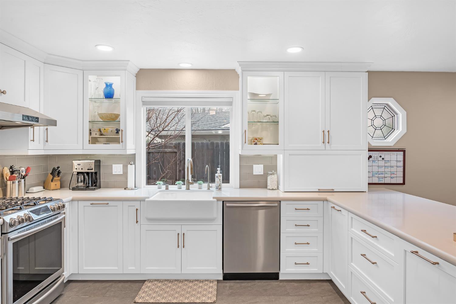 5220 Shelato Way Carmichael, CA 95608 - Photo 13 of 40 a kitchen with a sink stove and cabinets