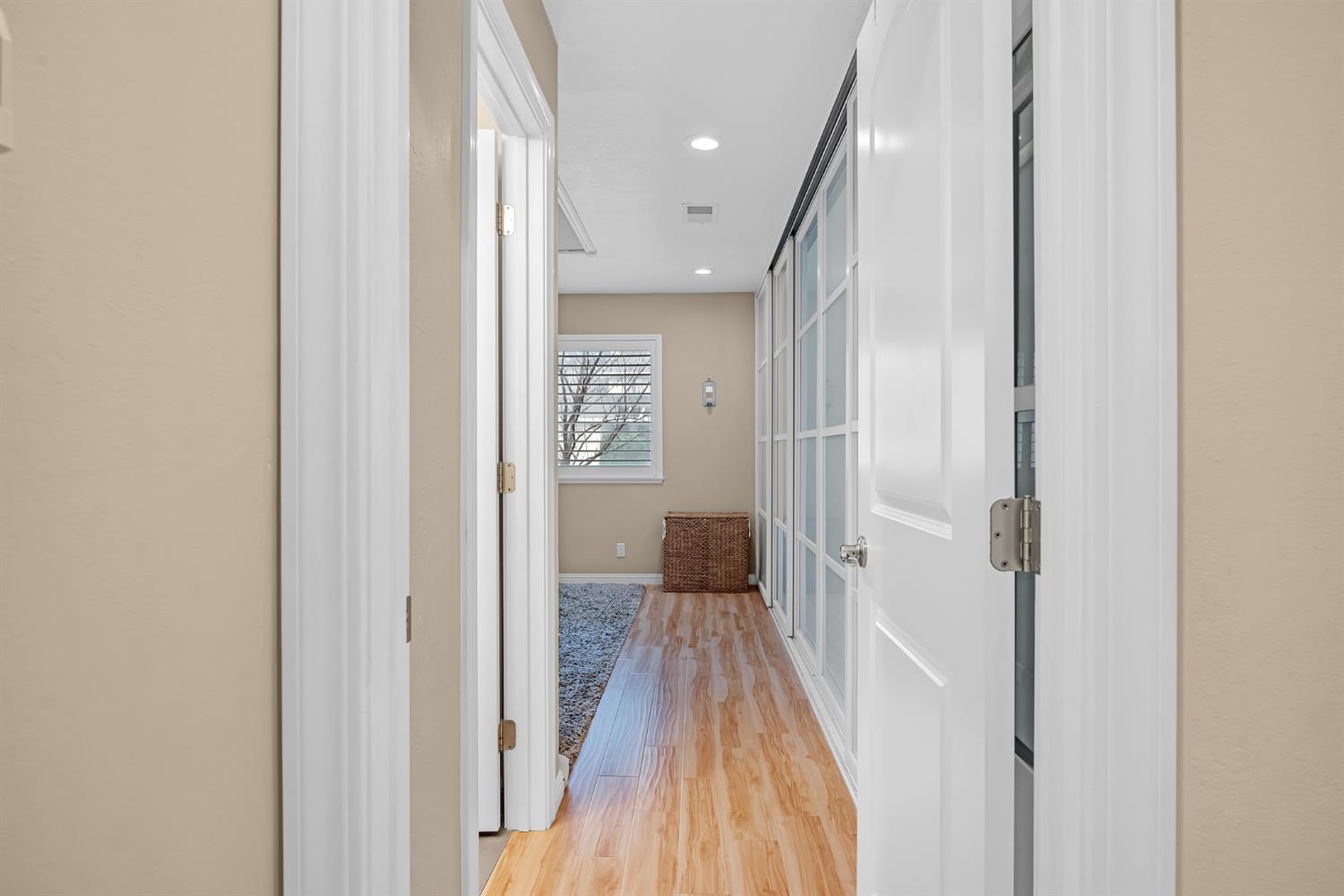5220 Shelato Way Carmichael, CA 95608 - Photo 19 of 40 a view of a hallway with wooden floor and a bathroom